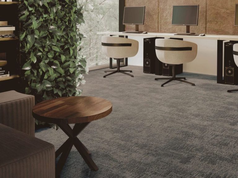Modern corporate office with soft grey textured carpet tiles and designer furniture
