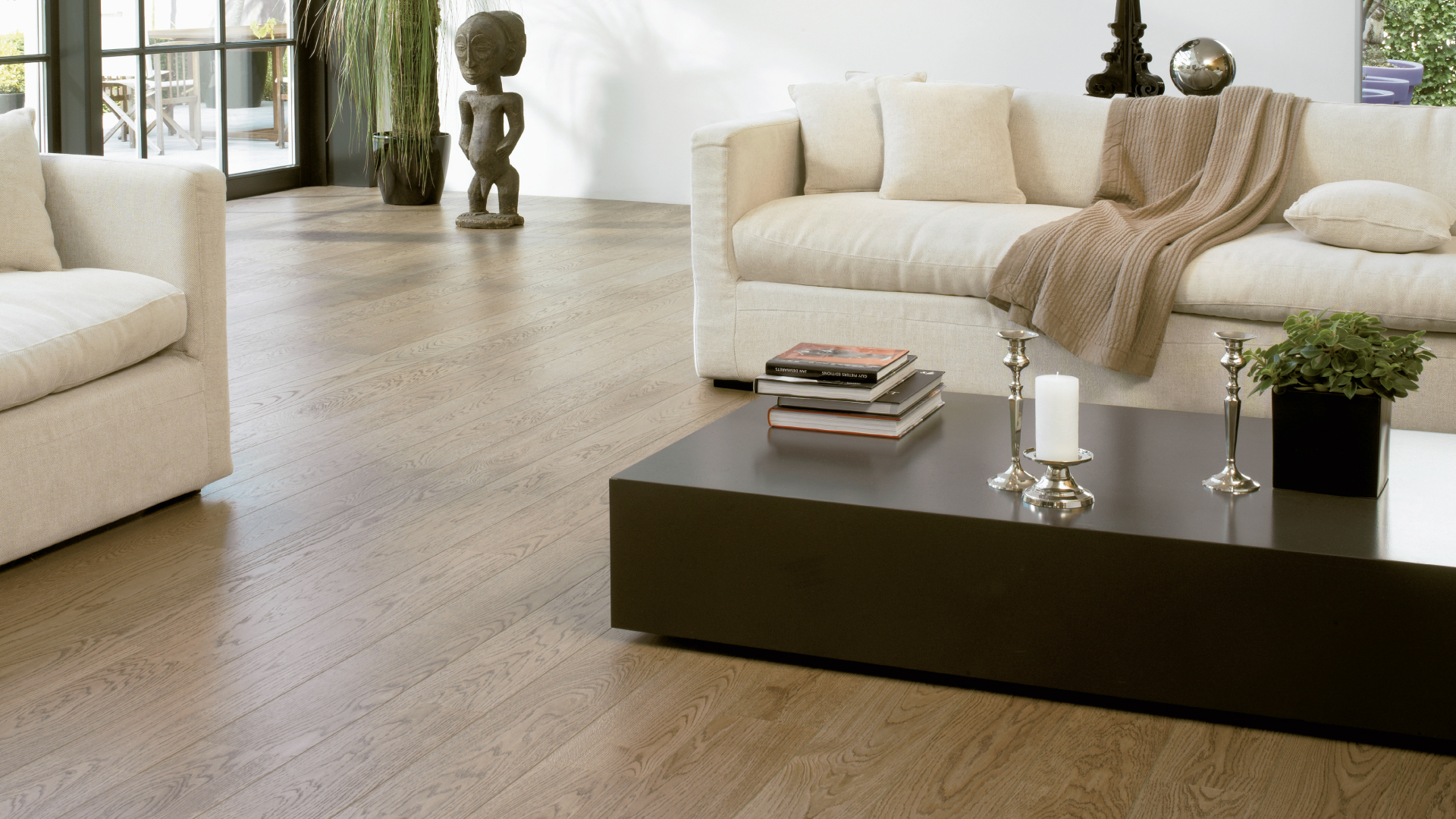 Contemporary lounge with wide-plank grey-washed oak flooring