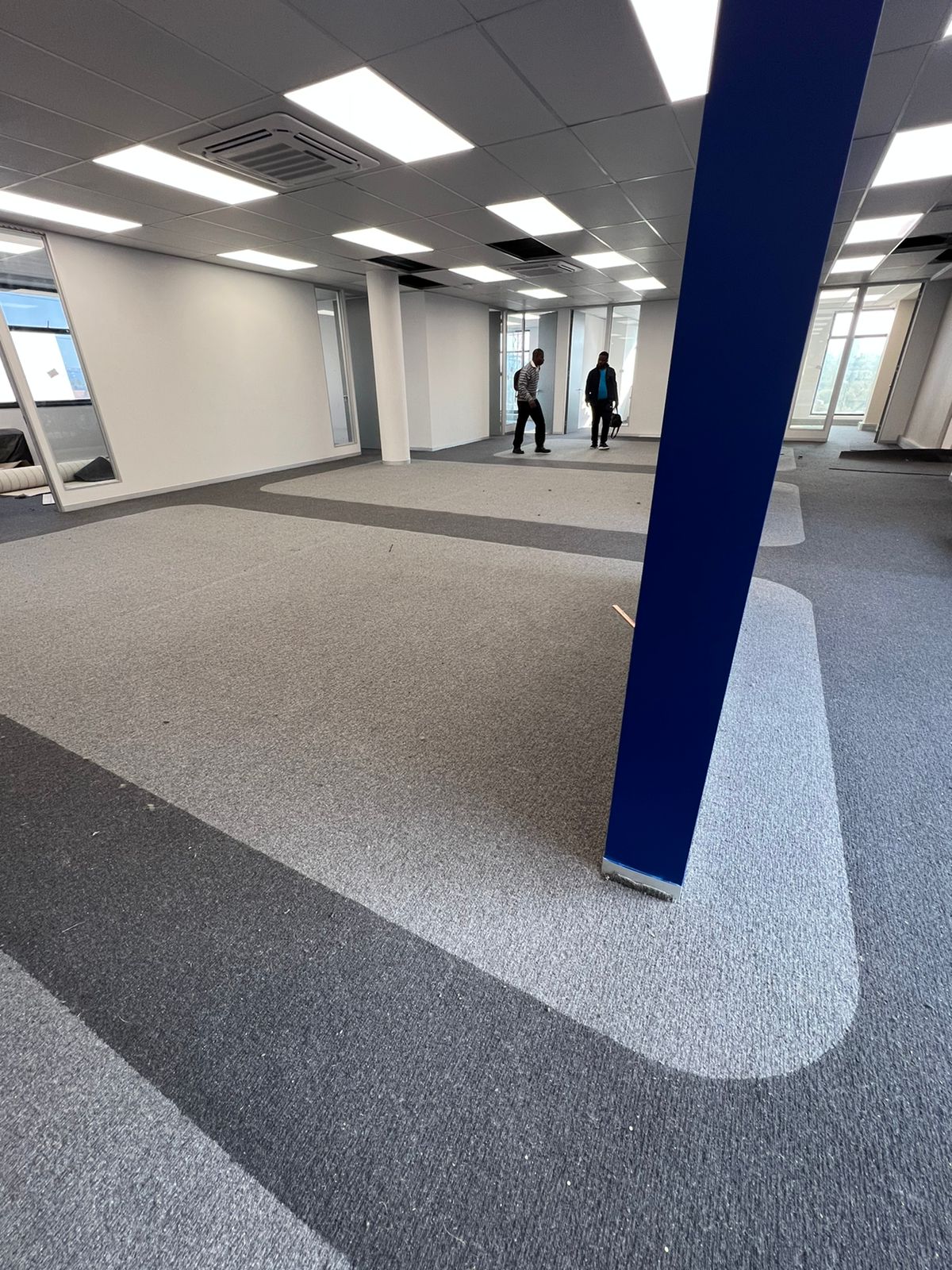 Corporate office two-tone carpet with curved inlay